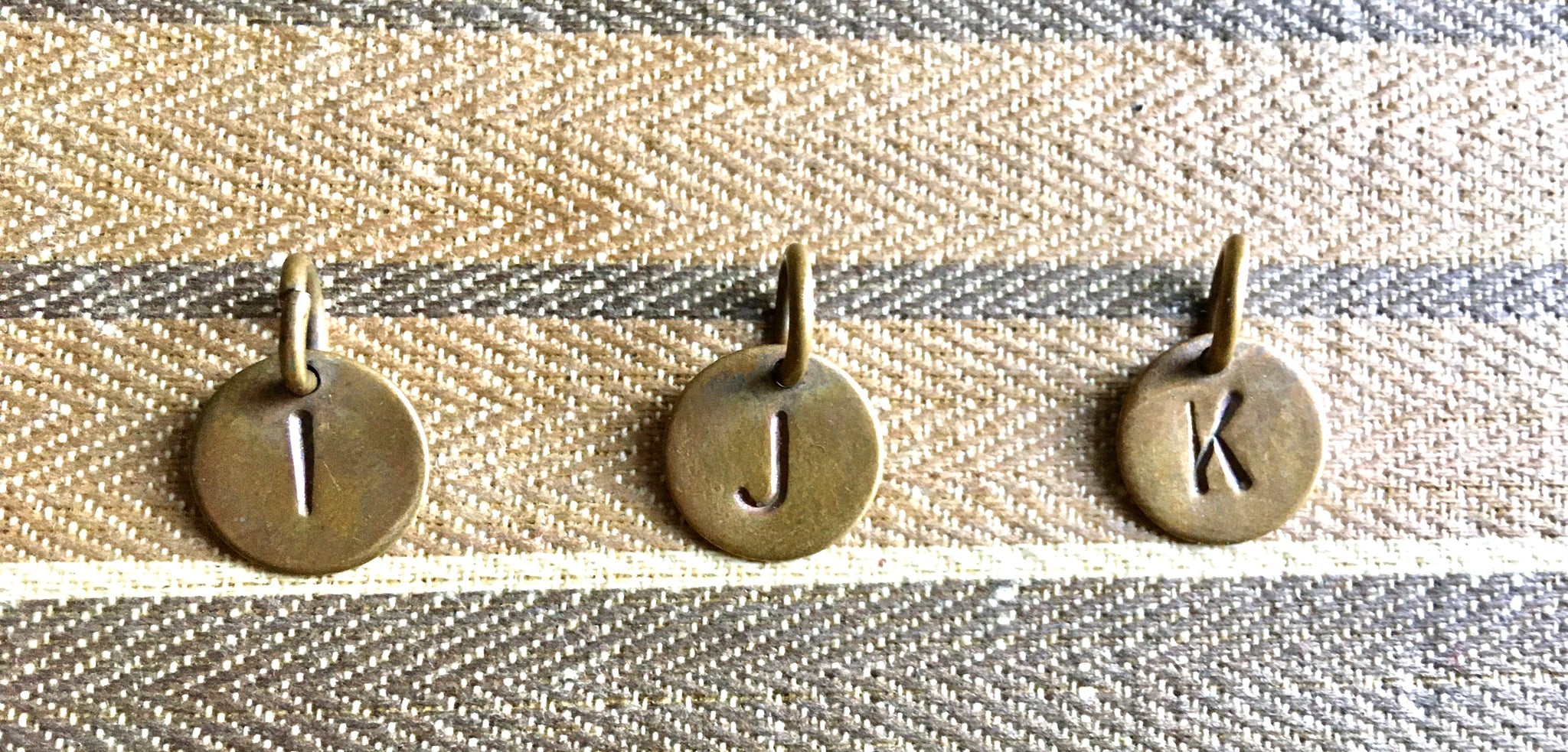 Brass letters I, J, K,L