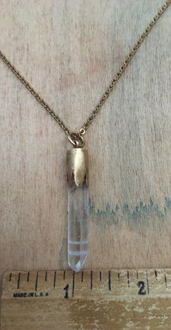 Crystal pendant on a brass chain