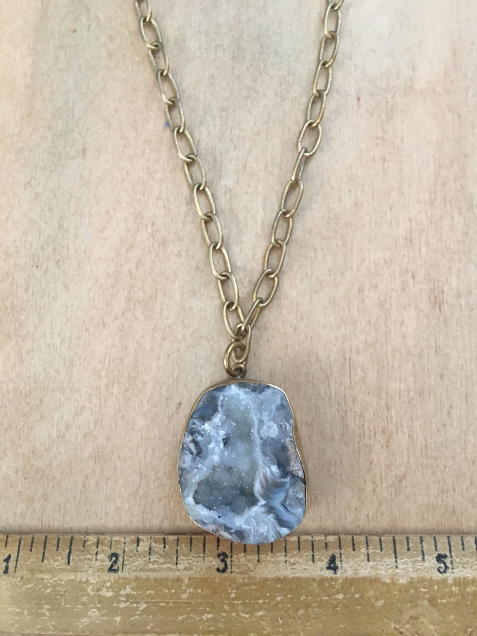 Chunky geode pendant on a 36” brass chain