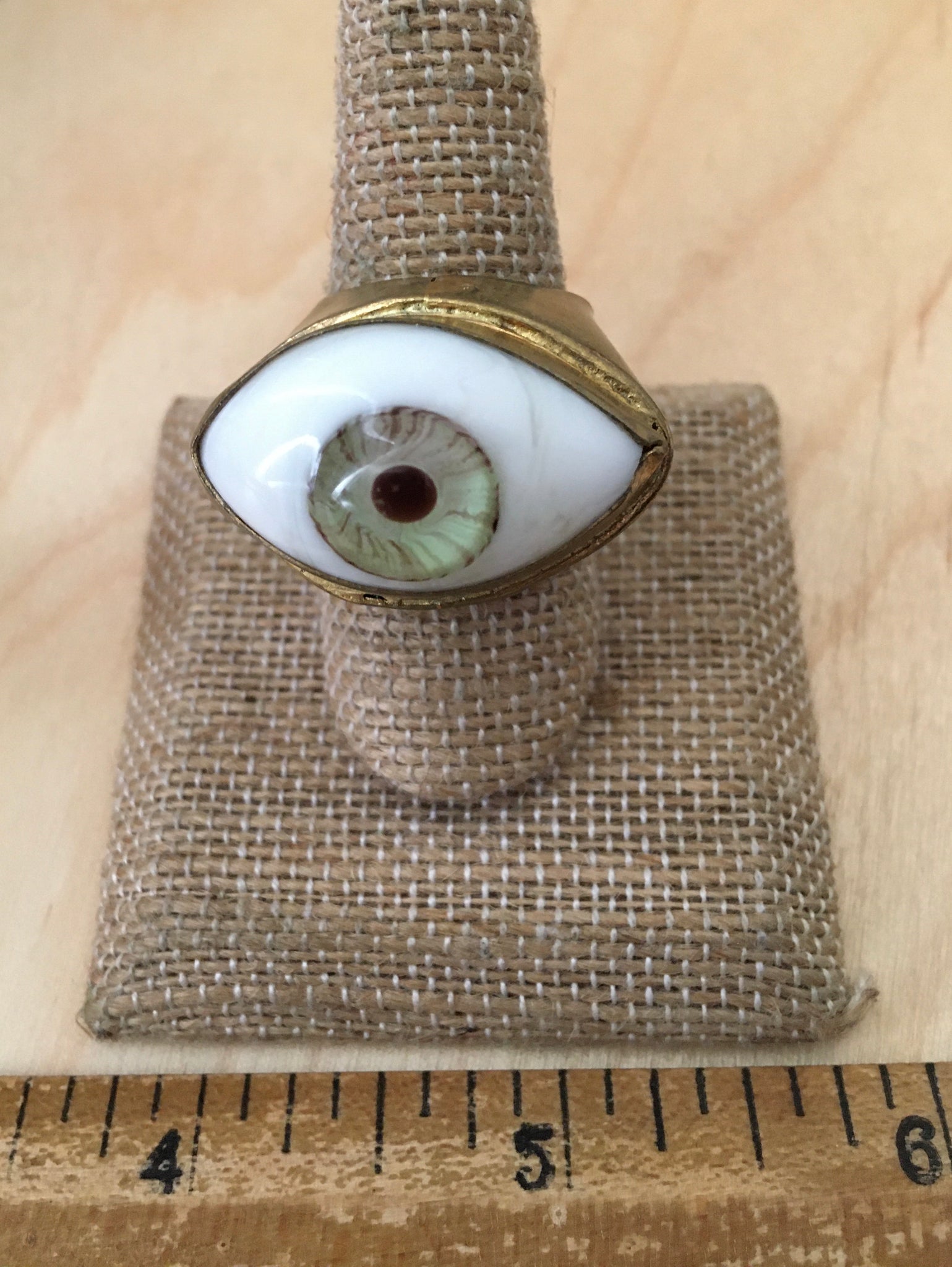 Green eyeball ring with a wide shank