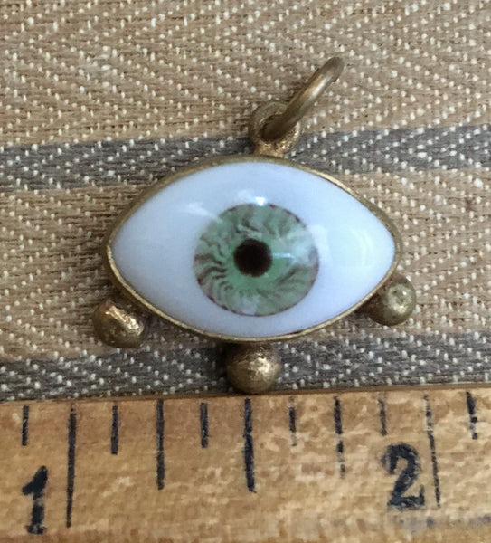 Brass medium green eye with stud lashes