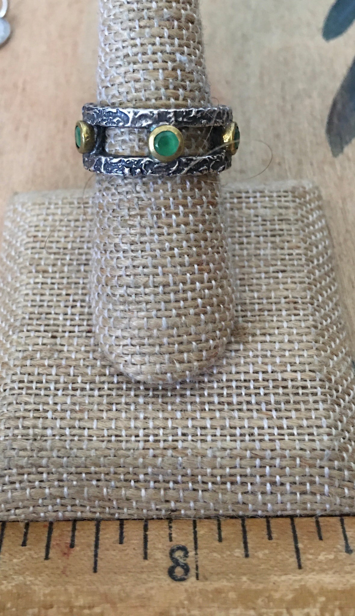 Sterling and emerald hammered band ring